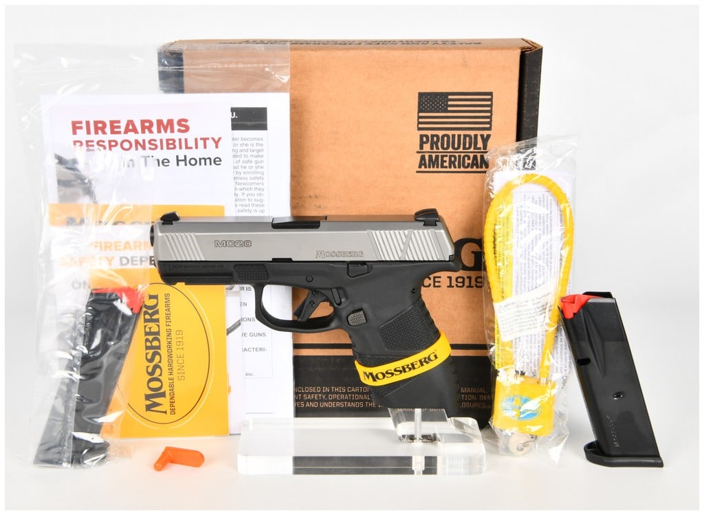 Mossberg MC2c Semi-Automatic 9mm Luger Pistol with Two Magazines and Original Box, 2022: This is a Mossberg MC2c semi-automatic striker-fired pistol chambered in 9mm Luger. The firearm features a stainless steel slide with front and rear cocking serrations and a black polymer frame with