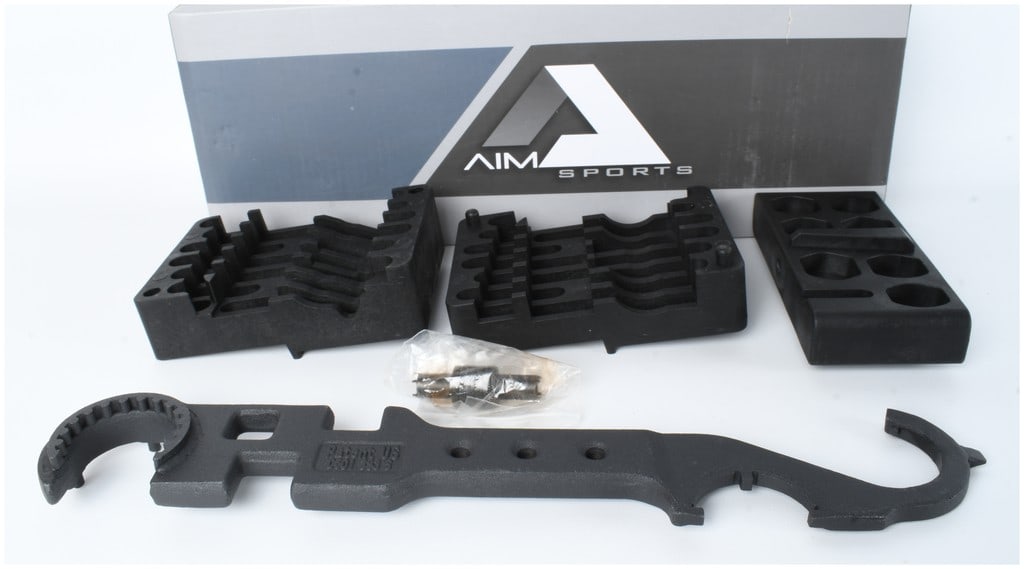 A Group of AIM Sports AR Platform Armorer Tools: A collection of AIM Sports AR platform armorer tools, SKU: ATARAK, designed for firearm maintenance and assembly. The set includes several black polymer bench blocks and vise blocks for securing