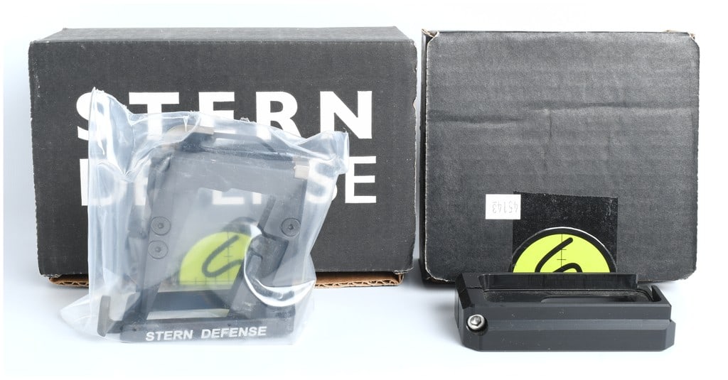 Stern Defense AR-15 9mm Magazine Conversion Adapter Lot, New in Box: A collection of two Stern Defense AR-15 magazine well conversion components designed to allow the use of pistol caliber magazines in a standard AR-15 lower receiver. The primary component is