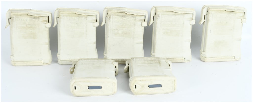 Seven Magpul PMAG 10 GEN M3 Polymer Magazines: A group of seven Magpul PMAG 10 GEN M3 polymer magazines designed for the 5.56x45mm AR/M4 platform. Each magazine is constructed from a sand-colored polymer. The exterior surfaces feature molded text