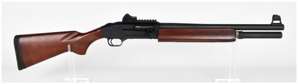 Mossberg 930 Semi-Automatic Shotgun 12 Gauge with 18.5 Inch Barrel Contemporary: A modern Mossberg Model 930 semi-automatic shotgun chambered in 12 gauge. This gas-operated firearm is configured for tactical or home defense use, featuring an 18 1/2 inch cylinder bore barrel capabl