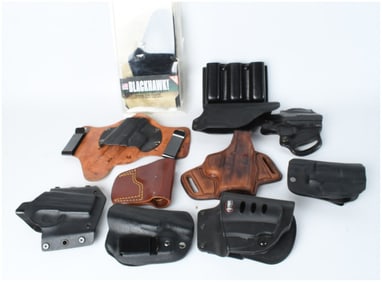 An Assortment of Gun Holsters and Magazine Carriers including Blackhawk Fobus and Galco
