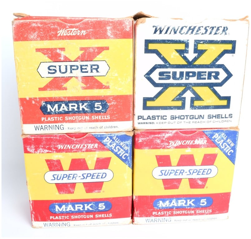 Winchester Western Mark 5 Vintage 12 Gauge Shotgun Ammunition Lot Circa 1960s: A collector's lot consisting of four vintage cardboard boxes of 12 Gauge shotgun ammunition manufactured by Winchester and Western. This lot features 85 total shells. The boxes represent the transitio