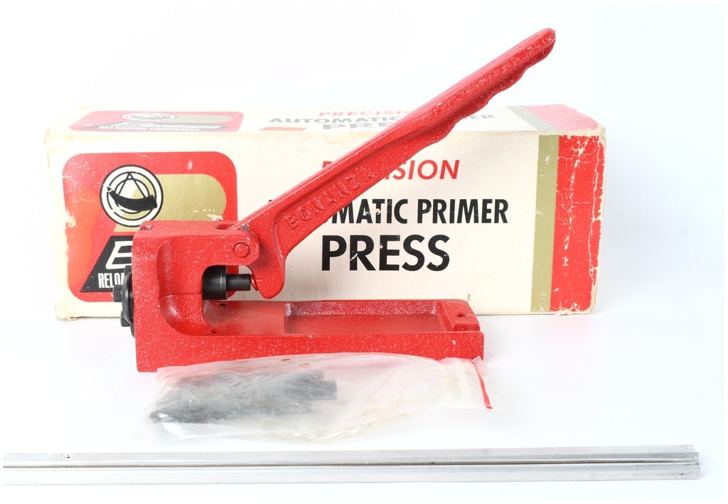 Bonanza Precision Automatic Primer Press Heavy Duty Cast Metal Reloading Tool with Original Box: A vintage Bonanza Precision Automatic Primer Press, constructed of heavy red-painted cast metal. This specialized reloading tool is designed for the precise and consistent seating of primers into