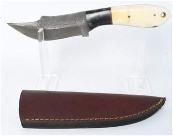 A Damascus Steel Skinning Knife with Bone and Horn Style Handle