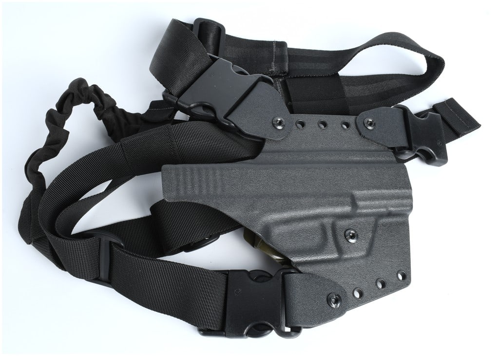 Unmarked Tactical Polymer Drop-Leg Holster Assemblies Pair Modern: A pair of contemporary tactical drop-leg holster assemblies constructed of molded polymer and heavy-duty black nylon webbing. These accessories are designed for rapid deployment and secure retention