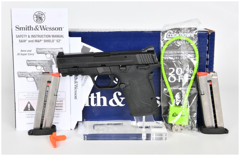 Smith & Wesson M&P Shield EZ Semi-Automatic Pistol, .30 Super Carry, c. 2022: This Smith & Wesson M&P Shield EZ is a modern semi-automatic pistol chambered in the .30 Super Carry caliber. The firearm features a durable black polymer frame paired with a matte black metal slide.