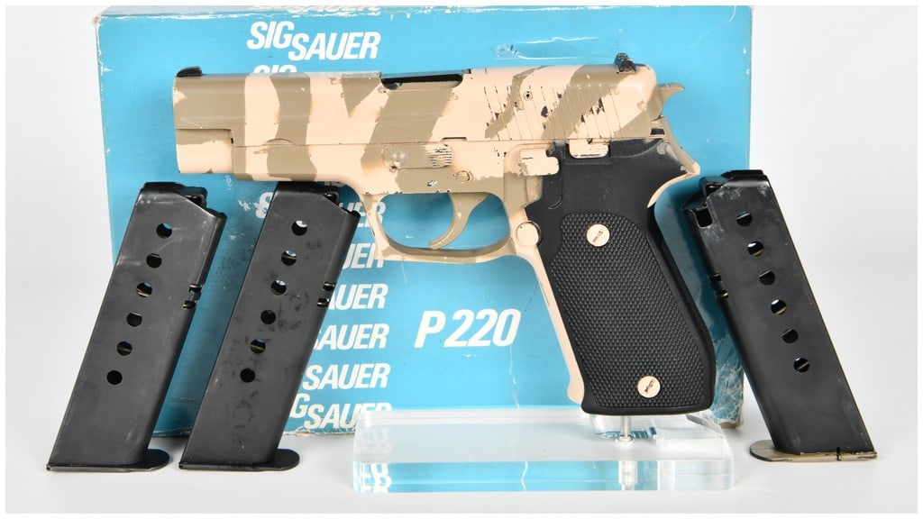 SIG Sauer P220 Semi-Automatic Pistol, .45 Auto, Custom Desert Camouflage, West German Manufacture,: This is a SIG Sauer P220 semi-automatic pistol chambered in .45 Auto. The firearm features a metal frame and slide finished in a custom desert camouflage paint scheme consisting of tan and olive drab