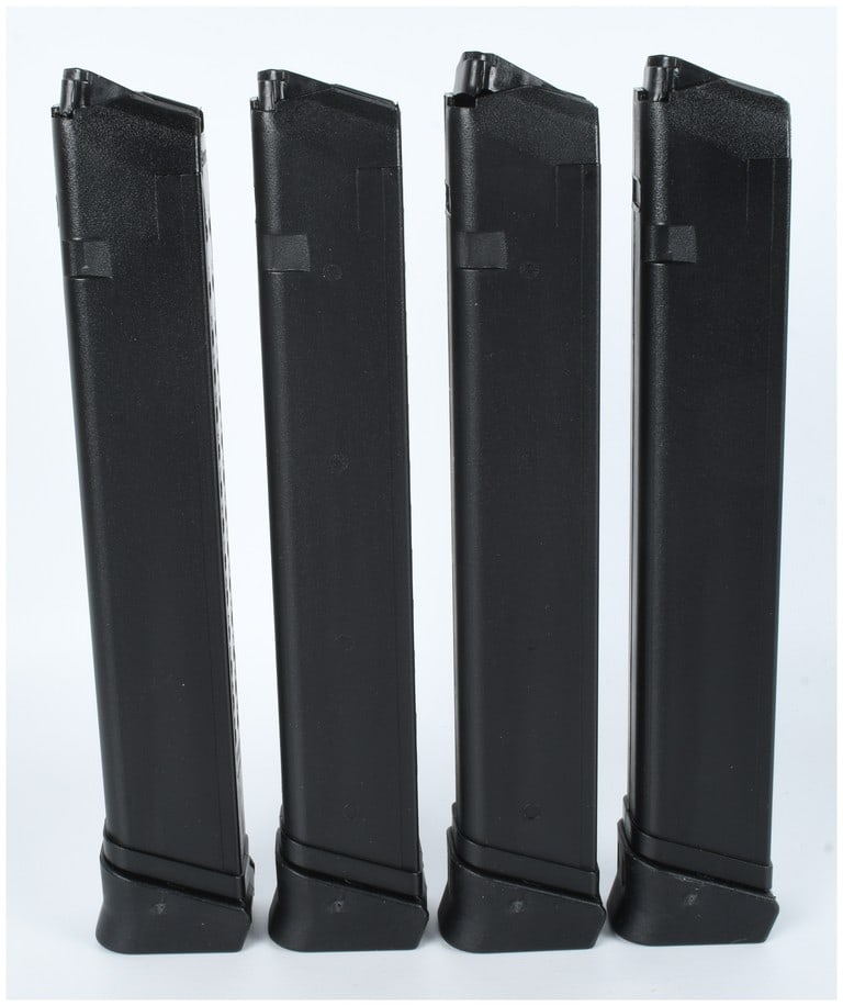 A Group of Four RWB 33-Round 9mm Magazines for Glock-Pattern Handguns: A group of four high-capacity 9mm magazines manufactured by RWB, designed for compatibility with Glock-pattern handguns. Each magazine is constructed from black polymer with metal feed lips and a