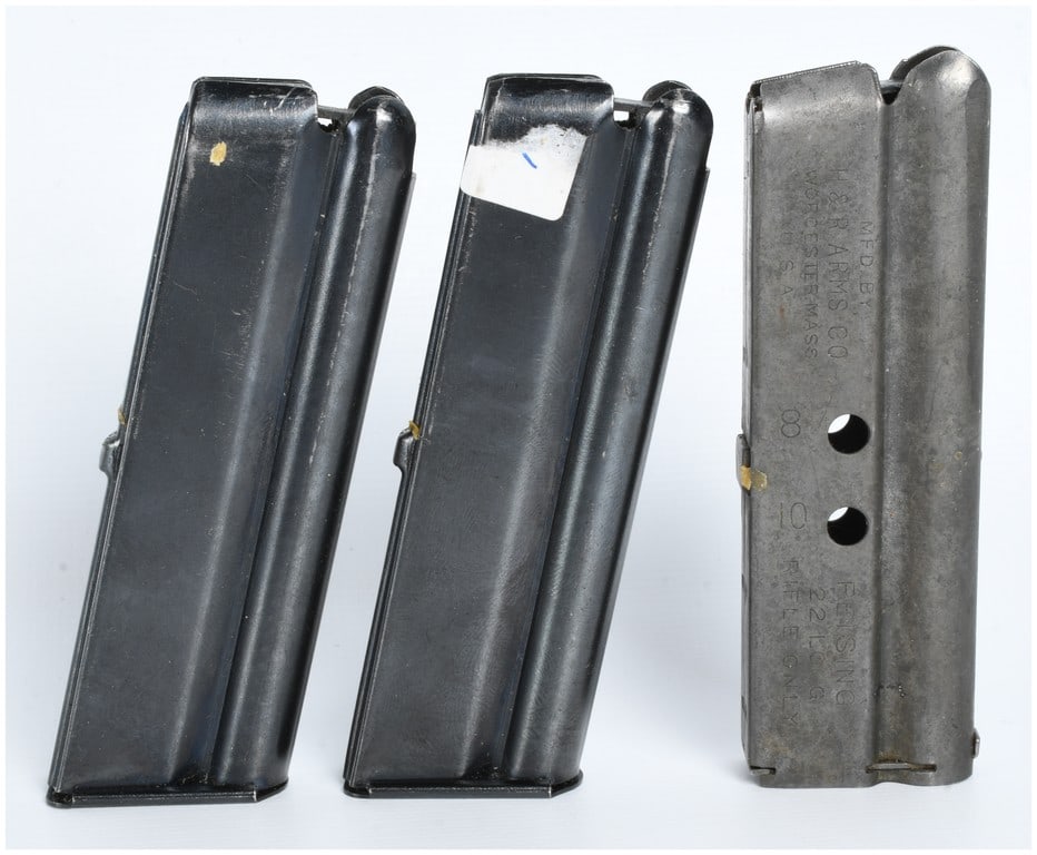 Three Marlin and H&R Reising .22 LR Magazines: A group of three steel firearm magazines for .22 caliber rifles. Two magazines feature a dark blued finish and are stamped with the Marlin name in cursive script on the baseplates. These magazines