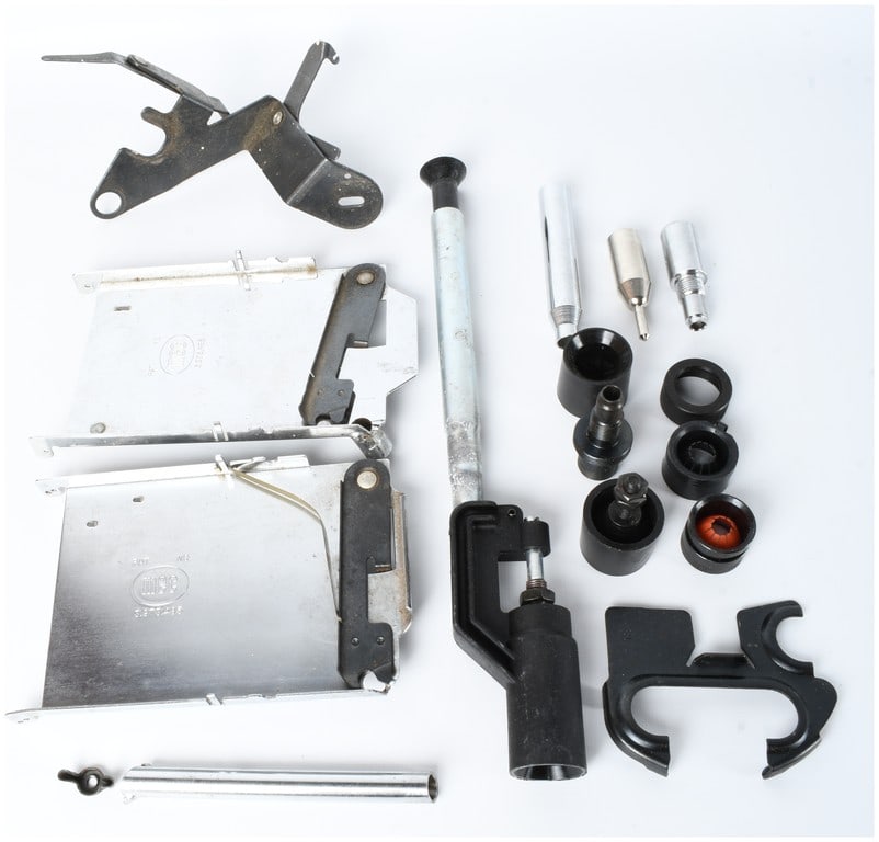 A Collection of MEC Shotshell Reloading Press Components and Accessories: This collection consists of various components and accessories for MEC brand shotshell reloading presses. The items are primarily constructed from chrome-plated and black-finished steel, with some