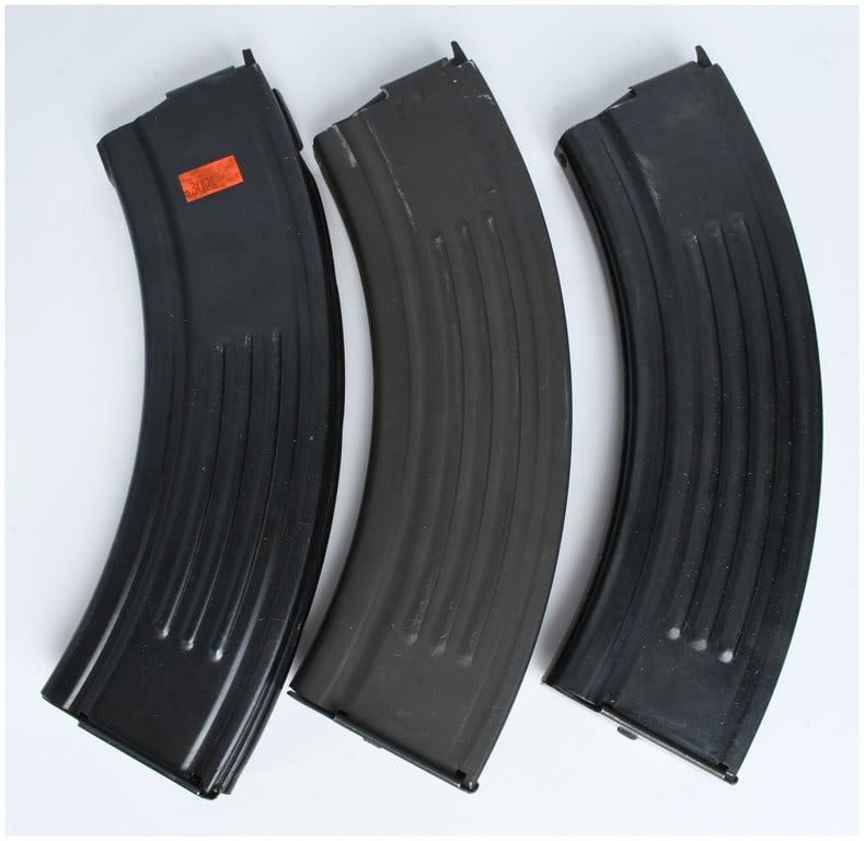 Three U.S.A. Magazines Ruger Mini-30 30-Round Steel Magazines: Three steel magazines manufactured by U.S.A. Magazines for the Ruger Mini-30 rifle. The magazines are constructed of steel with a dark blued or phosphate finish and feature vertical strengthening ribs