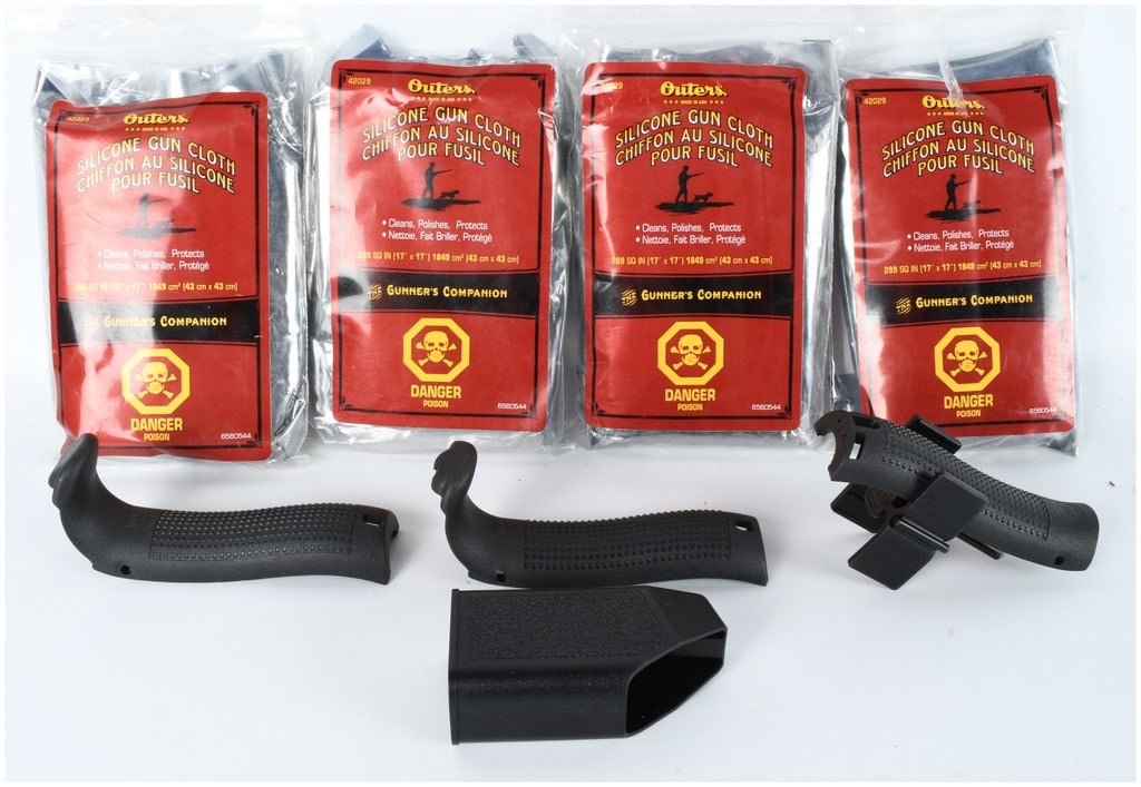 A Collection of Glock Beavertail Backstraps and Outers Silicone Gun Cloths: This collection consists of a Glock Beavertail Backstrap kit and several Outers The Gunner's Companion Silicone Gun Cloths. The firearm accessories are made of matte black textured polymer and include