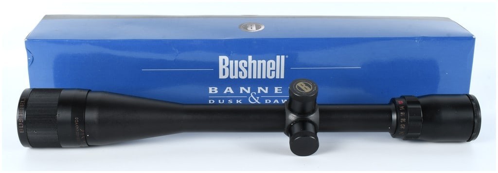 Bushnell Banner Dusk & Dawn 6X-24X40 Rifle Scope Model 71-6244 with Original Box: A high-power variable magnification telescopic rifle sight manufactured by Bushnell, part of their popular Banner series, known for the "Dusk & Dawn" light-gathering capability. This specific model is