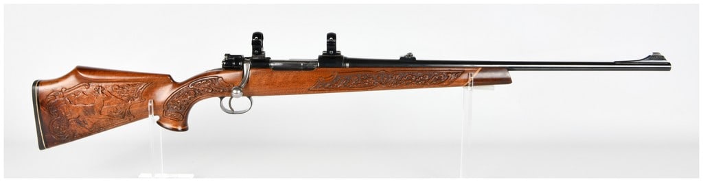 Parker-Hale Safari De Luxe Bolt Action Rifle .308 Winchester: This Parker-Hale Safari De Luxe is a bolt action rifle chambered in .308 Winchester, built on a commercial Mauser-style action. The firearm features a blued barrel equipped with a ramped blade front s