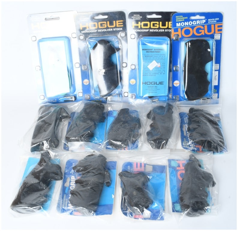 A Collection of Thirteen Hogue Monogrip Rubber Firearm Grips: A collection of thirteen aftermarket firearm grips from the Hogue Monogrip product line. The assortment is constructed from textured, recoil-absorbing rubber designed for various handgun models. The g