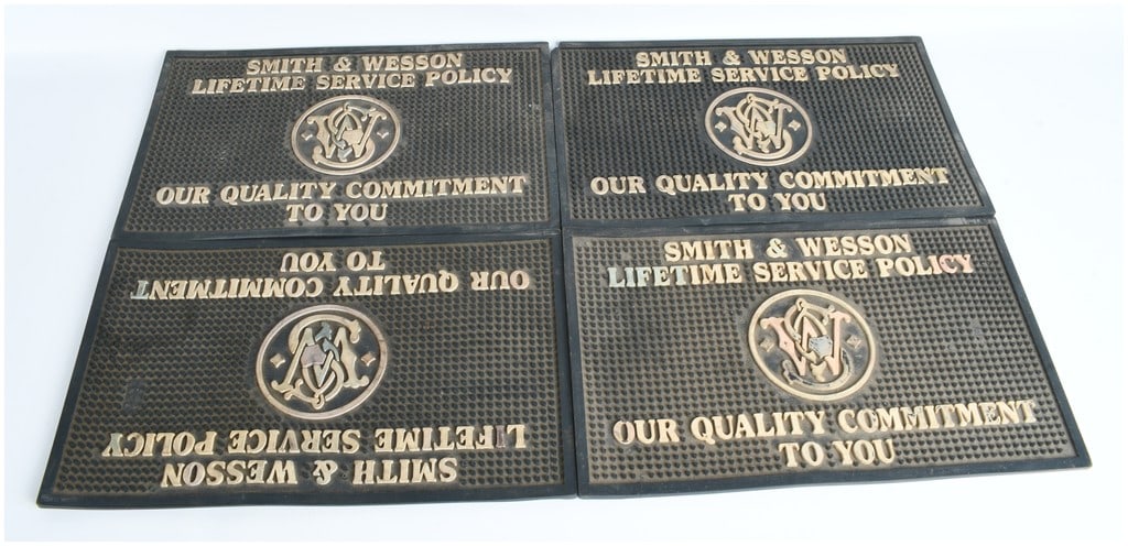 A Collection of 4 Smith & Wesson Lifetime Service Policy Rubber Counter Mats (1 of 2)