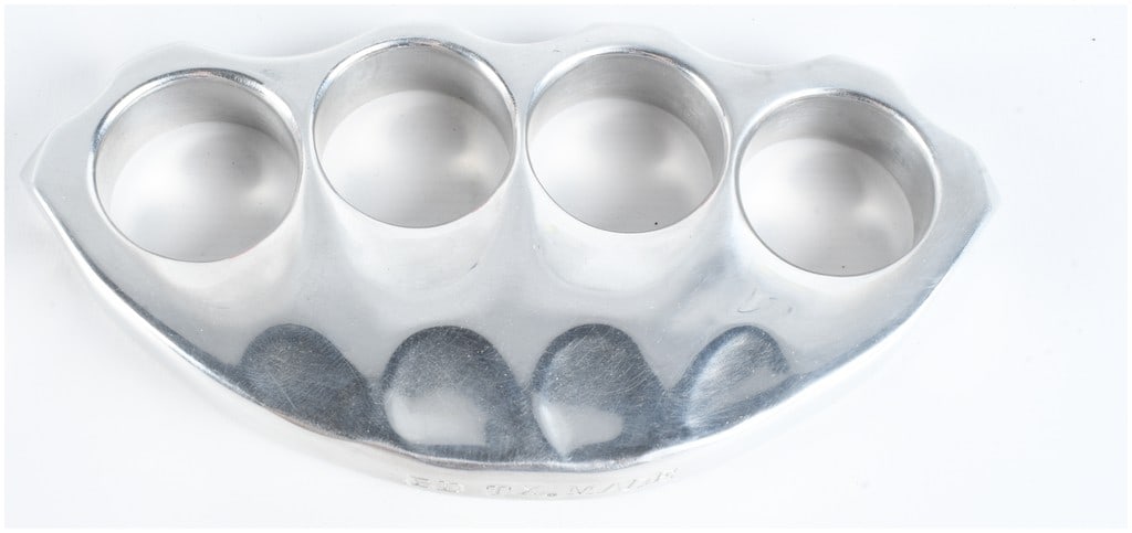 Brandon Davis Custom Texas Made Signed Knuckle Dusters: A set of custom four-finger knuckle dusters manufactured by Brandon Davis in Texas. The piece is constructed from a solid piece of polished metal, likely aluminum or stainless steel, featuring a high-
