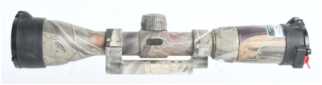 Nikon Omega 3-9x40mm BDC 300 Muzzleloader Riflescope: This Nikon Omega variable-power riflescope is designed for muzzleloading applications, featuring a 3-9x magnification range and a 40mm objective lens. The unit is finished in a Realtree Hardwoods camo