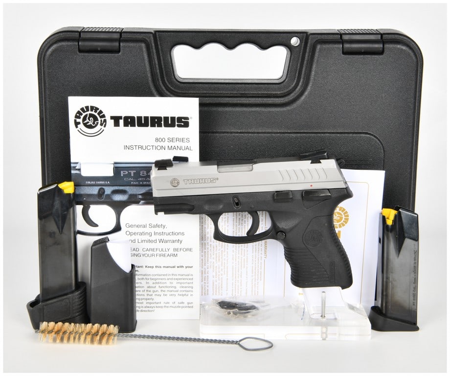 Taurus PT 809 C Semi-Automatic Pistol 9mm with 3.5 Inch Barrel: This lot features a Taurus PT 809 C semi-automatic hammer-fired pistol chambered in 9mm. The firearm is configured with a 3.5 inch barrel and a two-tone finish consisting of a brushed stainless steel