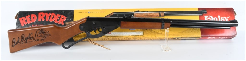 Daisy 1938 Red Ryder Lever Action Air Rifle .177 Caliber: This Daisy 1938 Red Ryder is a lever-action air rifle chambered for .177 caliber (4.5mm) steel BBs, operating as a gravity-feed spring-piston repeater. The rifle features a black finish on the metal r