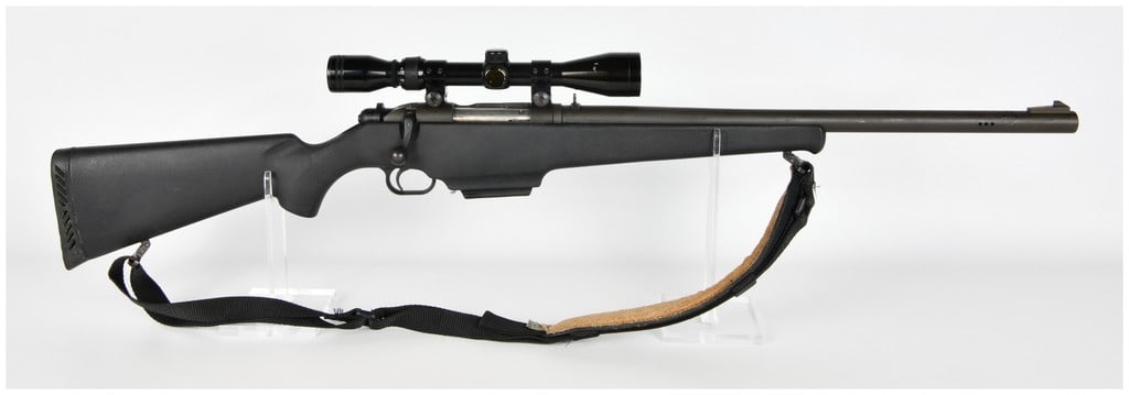 Mossberg Model 695 Bolt Action Shotgun 12-gauge with 22 Inch Barrel: This Mossberg Model 695 is a bolt-action 12-gauge shotgun specifically configured as a dedicated slug gun. The firearm features a 22-inch rifled bore barrel that is ported near the muzzle to mitigate