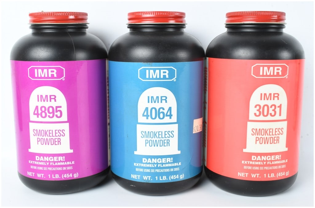 A Trio of IMR Smokeless Rifle Powder Canisters including IMR 4895 IMR 4064 and IMR 3031 totaling 2.5: This lot consists of three canisters of smokeless rifle powder manufactured by the IMR Powder Co. for use in reloading various rifle cartridges. The group includes one one-pound bottle of IMR 4895