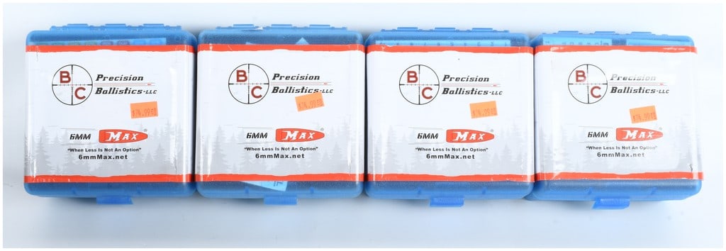 A Lot of 400 BC Precision Ballistics 6mm Max Unprimed Brass Casings: This lot consists of 400 pieces of unprimed 6mm Max brass shell casings manufactured by BC Precision Ballistics-LLC, organized into four blue plastic flip-top cases each containing 100 pieces. These