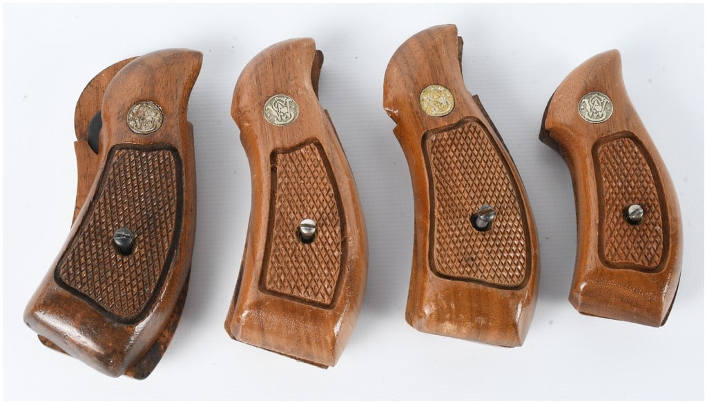 4 Sets of Smith & Wesson Checkered Walnut Revolver Grips: This lot consists of 4 sets of factory revolver grips manufactured by Smith & Wesson. Each set is constructed from walnut with a glossy varnished finish and features diamond-pattern checkering on the
