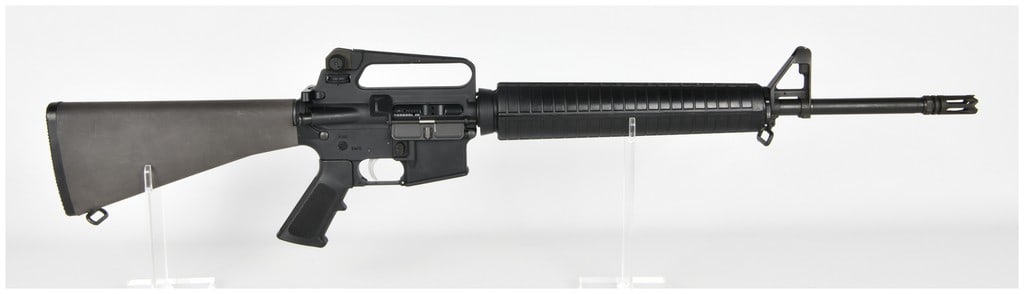 Bushmaster XM15-E2S Semi-Automatic Rifle .223-5.56mm: This Bushmaster XM15-E2S is a semi-automatic rifle chambered in .223-5.56mm, configured in a traditional A2-style pattern. The rifle features a matte black finish on the upper and lower receivers and