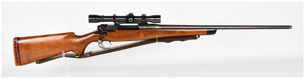 Remington Model 1917 Sporterized Bolt Action Rifle .30-06 Springfield: This is a sporterized bolt-action rifle built on a U.S. Model 1917 military action, chambered in .30-06 Springfield. The rifle features a blued finish on the barrel and receiver and is housed in a cus