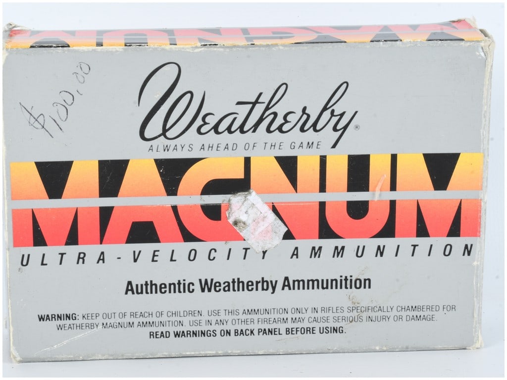 A Lot of 21 Weatherby Ultra-Velocity .257 Weatherby Magnum Ammunition and Cases: This lot features a vintage grey cardboard box of Weatherby Ultra-Velocity ammunition chambered in .257 Weatherby Magnum. While the exterior packaging is labeled for twenty cartridges and specifies un