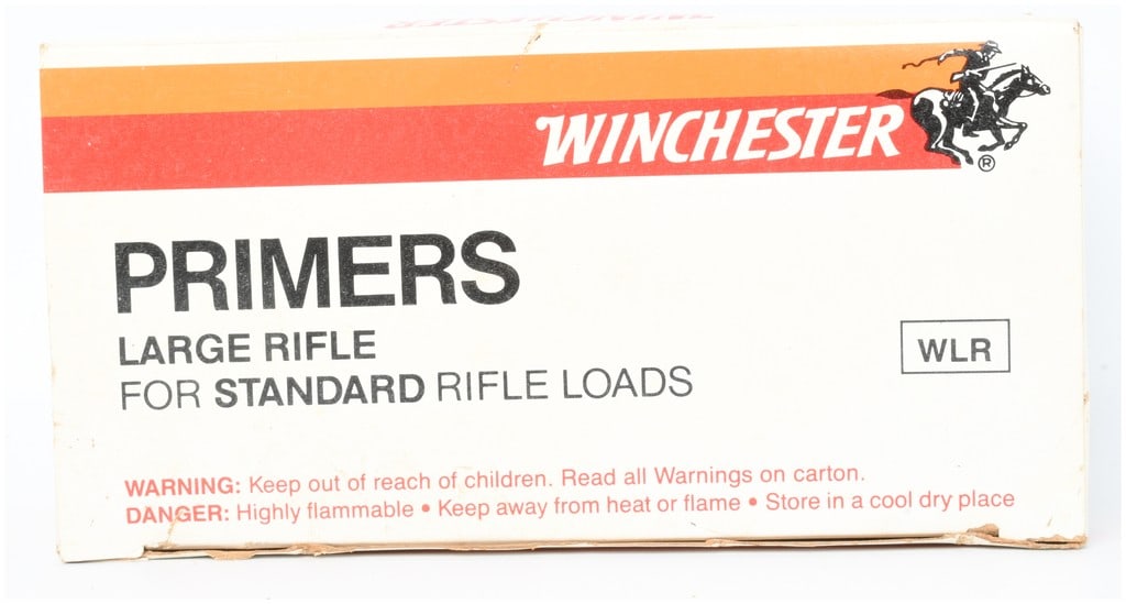 1000 Count of Winchester Large Rifle Primers: A quantity of 1000 Winchester Large Rifle (WLR) primers for standard rifle loads. The primers are seated in black plastic 10x10 grid trays and housed within original cardboard packaging. The boxes are