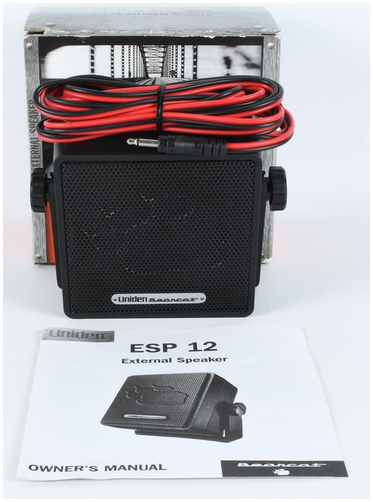 Uniden Bearcat ESP 12 External Communications Speaker: This Uniden Bearcat ESP 12 external speaker is designed for use with CB radios and scanners. The unit features a black plastic housing with a protective metal mesh grille. A silver-toned badge reading
