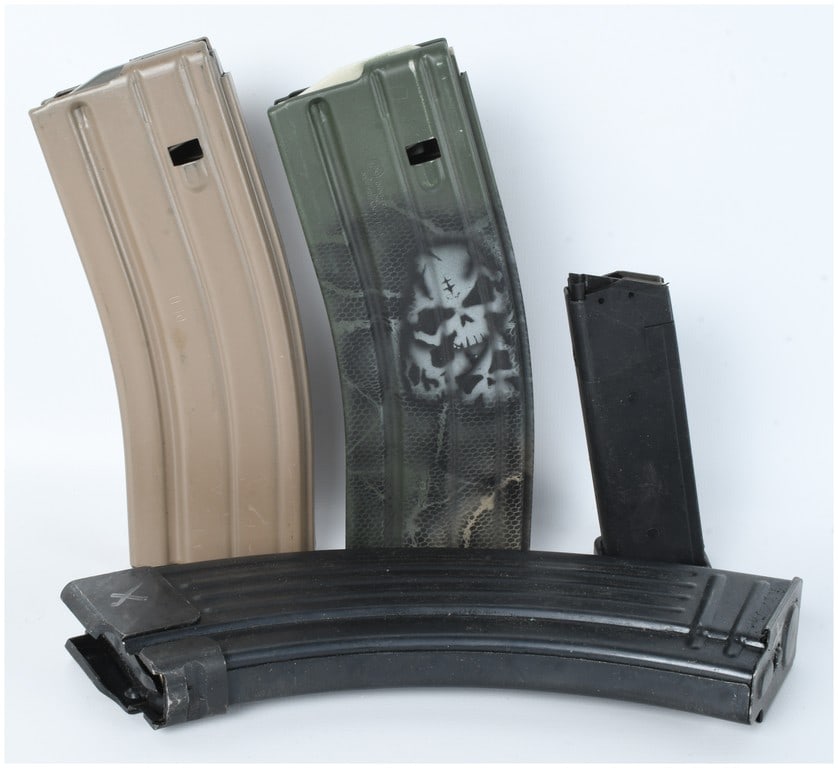A Collection of 4 Firearm Magazines for AR-15 and AK-47 Type Rifles: This lot features a collection of four firearm magazines designed for various semi-automatic platforms. The collection includes two 30-round capacity magazines for the AR-15 and M16 platform, one of w