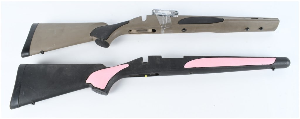 A Pair of Remington Model 700 Bolt Action Rifle Stocks: This lot features a pair of synthetic stocks manufactured for Remington Model 700 bolt-action rifles. The first stock is finished in a dark earth or tan polymer with black rubberized overmolded panels