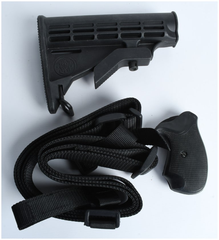 A Trio of Firearm Accessories Including a Smith and Wesson Buttstock and Pachmayr Grip (1 of 6)