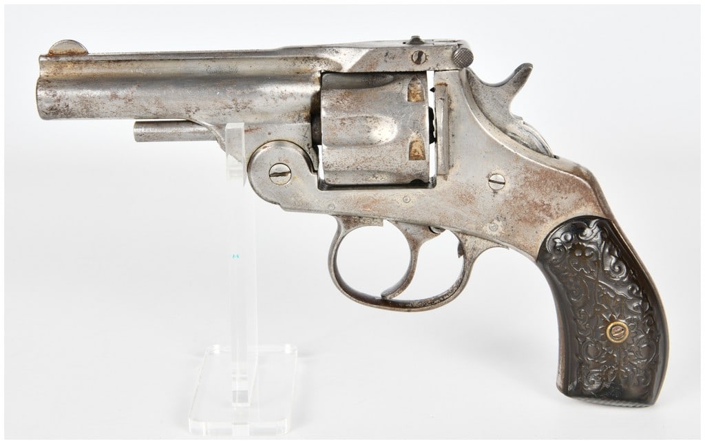 Harrington & Richardson Automatic Ejecting Top-Break Double-Action Revolver .32 S&W with 3.25 Inch: This Harrington & Richardson Automatic Ejecting revolver is chambered in .32 S&W and features a five-shot capacity cylinder. The firearm is configured with a 3.25-inch barrel and utilizes a top-break
