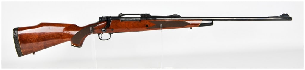 Winchester Model 70 XTR Bolt Action Rifle .264 Win. Magnum with Blued Steel Barrel: This Winchester Model 70 XTR is a bolt-action rifle chambered in .264 Winchester Magnum, a high-velocity caliber designed for long-range sporting use. The rifle features a blued steel barrel and recei