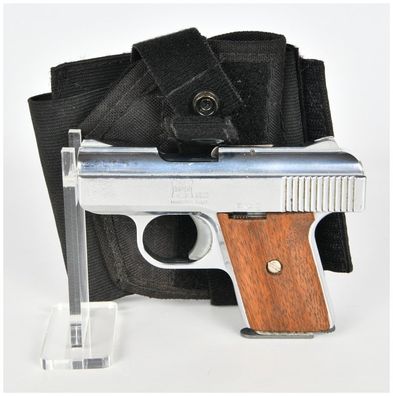 Raven Arms Model MP-25 Semi-Automatic Pistol .25 Auto with 2.5 Inch Barrel: This Raven Arms Model MP-25 is a semi-automatic pocket pistol chambered in .25 Auto featuring a 2.5 inch barrel. The firearm is finished in bright chrome and is fitted with smooth wood grip panels. Ke