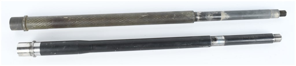 A Pair of Boss Barrels and Unmarked AR-15 Semi-Automatic Rifle Barrels 5.56mm and 6mm MAX: This lot consists of a pair of rifle barrels designed for the AR-15 platform, each featuring an installed barrel extension and a threaded muzzle. The top barrel is attributed to Boss Barrels and featu