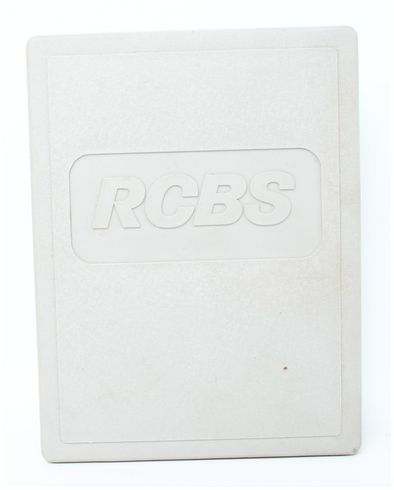 A Cased Pair of RCBS 18915 Carbide Taper Crimp Reloading Dies .45 Auto: This lot features a pair of RCBS carbide reloading dies for .45 Auto, originally part of a three-die taper crimp set. The components are housed in a gray plastic RCBS storage case with an embossed log