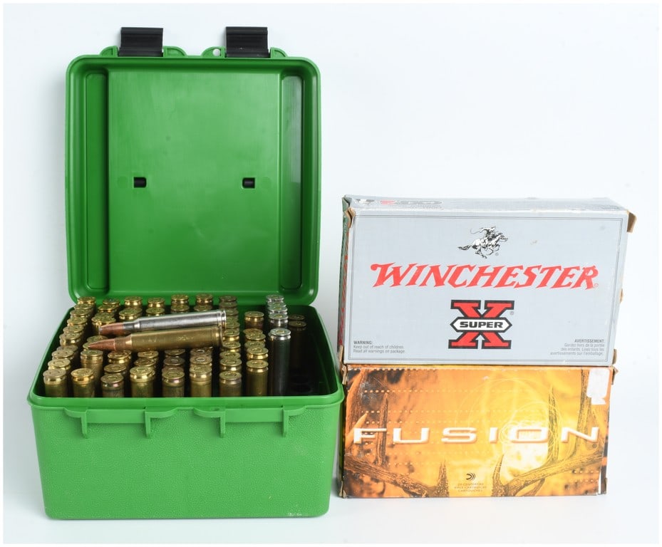 A Lot of 93 .300 Winchester Magnum Centerfire Rifle Cartridges: This lot features a collection of 93 centerfire rifle cartridges in .300 Winchester Magnum caliber, comprising various manufacturers and projectile types. The ammunition is organized into one green