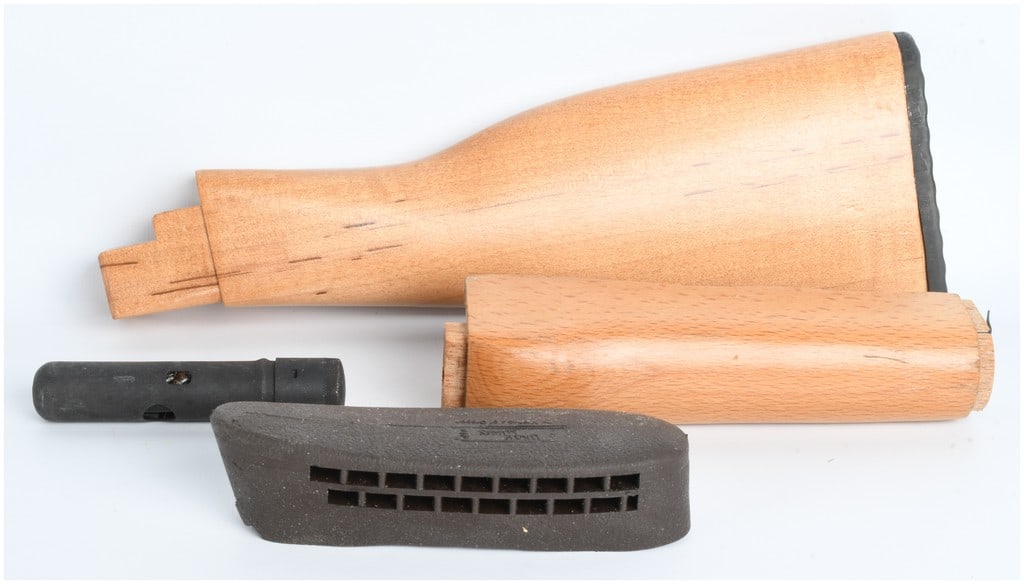 A Collection of 4 Firearm Accessories Including AK-Type Wood Furniture and Uncle Mike's Recoil Pad: This lot consists of a collection of four firearm accessories and components, featuring a replacement wood furniture set suitable for an AK-type rifle. Included are a buttstock and a lower handguard,