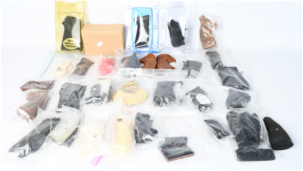 A Collection of 27 Assorted Handgun Grips and Stocks: This lot consists of a collection of 27 assorted handgun grip sets and individual stocks designed for various revolver and semi-automatic pistol models. The assortment features a diverse range of mate