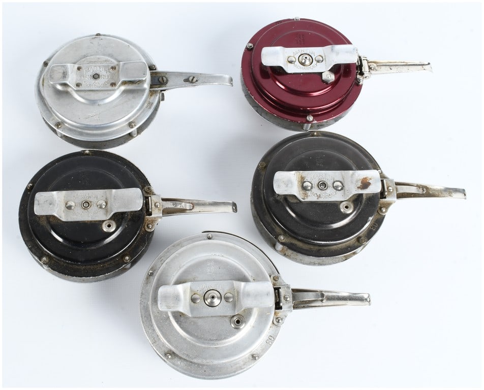 A Collection of Martin Automatic Fly Fishing Reels: This collection of automatic fly fishing reels was manufactured by the Martin Automatic Fish Reel Co. of Mohawk, New York. The assortment includes reels in three different finishes: two in a silver-to