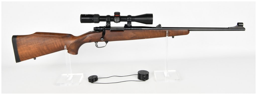 Zastava Arms Model M85 Bolt Action Rifle 7.62x39mm with 20 Inch Barrel: This Zastava Arms Model M85 is a bolt action rifle chambered in the 7.62x39mm cartridge. It features a blued steel finish on the barrel and receiver, paired with a checkered wood Monte Carlo stock tha