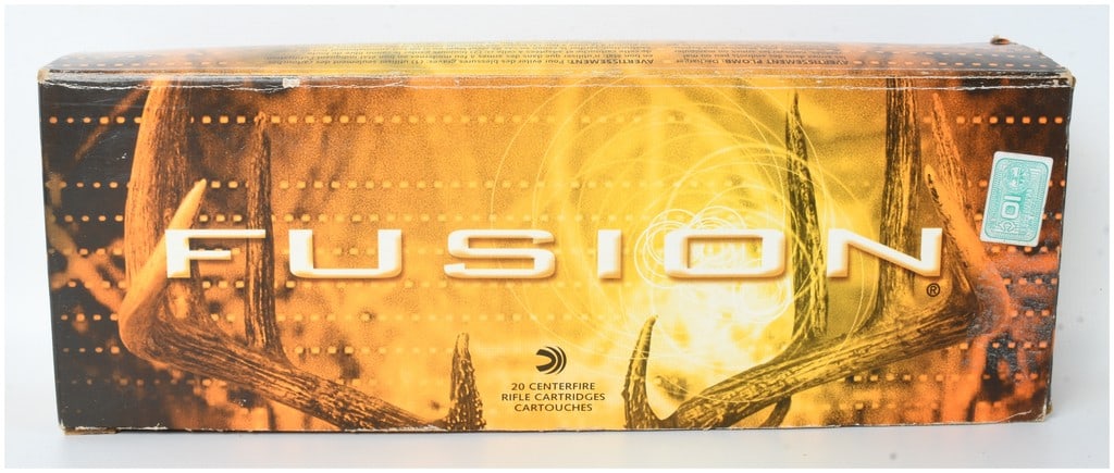 A Lot of 20 Federal Fusion Centerfire Rifle Ammunition 7mm WSM: This lot comprises twenty Federal Fusion 7mm Winchester Short Magnum (WSM) centerfire rifle cartridges featuring 150-grain bonded soft point bullets. The ammunition is contained in its original orange