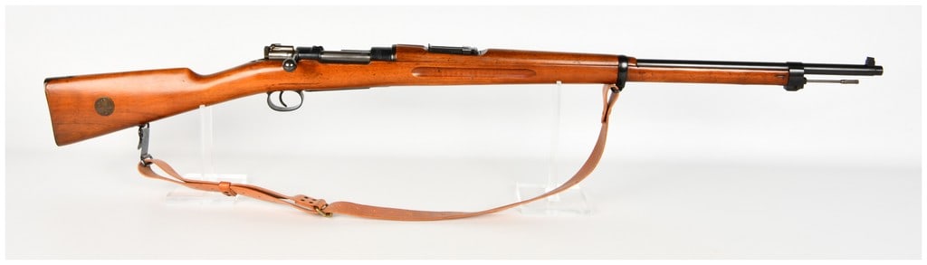 Carl Gustafs Stads Gevärsfaktori m/96 Bolt Action Rifle 6.5x55mm with 29 Inch Barrel 1915: This Carl Gustafs Stads Gevärsfaktori m/96 is a Swedish military bolt-action rifle chambered in 6.5x55mm. It is equipped with a 29-inch barrel featuring a blade front sight and a tangent rear sight g