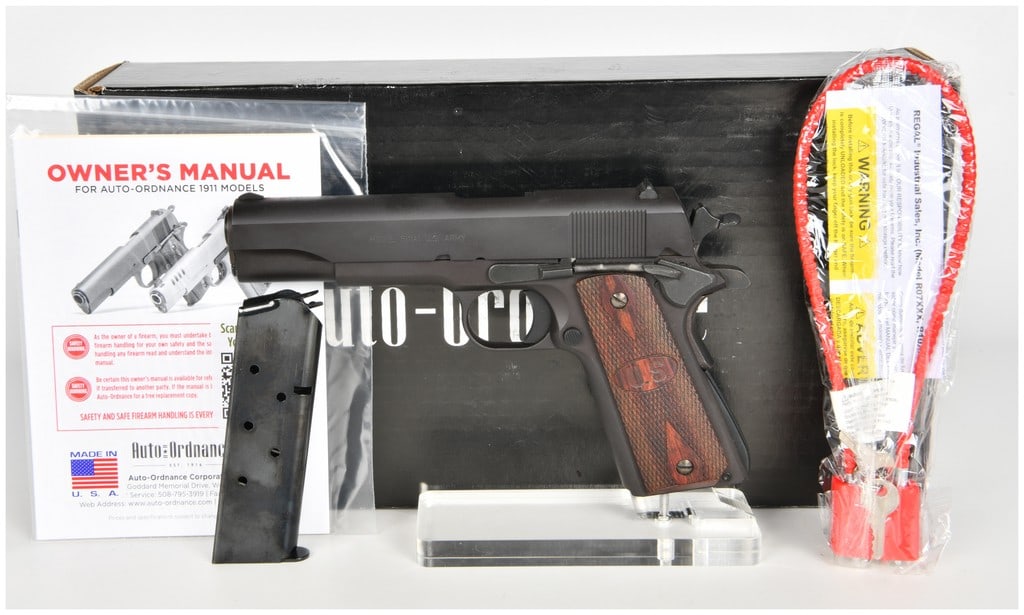 Auto-Ordnance Model 1911A1 Semi-Automatic Pistol .45 ACP with 5 Inch Barrel: This semi-automatic pistol is an Auto-Ordnance Model 1911A1 chambered in .45 ACP, designed to replicate the classic United States military sidearm. The firearm features a 5 inch barrel and a non-refle